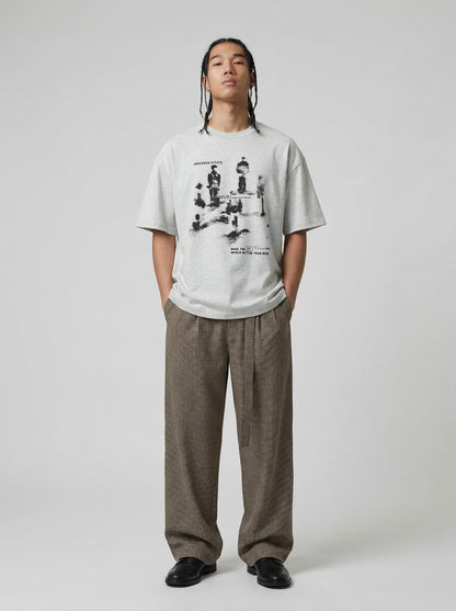 DAXUEN Oversized graphic T-shirt with human figures and text — model photo