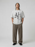 DAXUEN Oversized graphic T-shirt with human figures and text — model photo