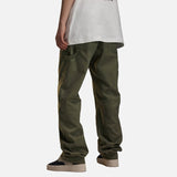 DAXUEN Loose-fit utility trousers in olive green and black — model photo