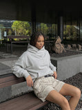 DAXUEN Loose-fitting utility shorts with pockets and belt — model photo