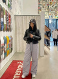 DAXUEN Wide-leg utility pants with drawstring and pockets — model photo