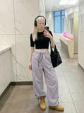 DAXUEN Wide-leg utility pants with drawstring and pockets — model photo