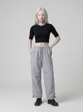 DAXUEN Wide-leg utility pants with drawstring and pockets — model photo
