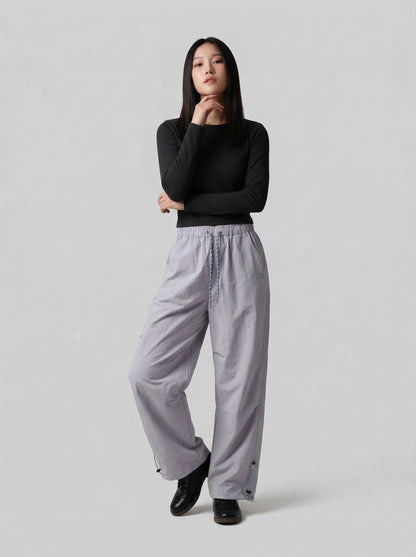 DAXUEN Wide-leg utility pants with drawstring and pockets — model photo
