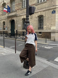 DAXUEN dark grey curved leg high-rise trousers with button detail — model photo