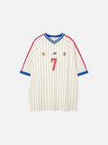 Cream and dark pinstripe football jersey t-shirt with a blue V-neck collar, red shoulder stripes, and a red number 7 on the chest