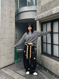 DAXUEN black oversized beach scene graphic tee — model photo