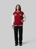 DAXUEN Varsity bomber jacket with contrasting colors and graphics — model photo