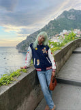 DAXUEN Relaxed fit varsity jacket with embroidered graphics — model photo