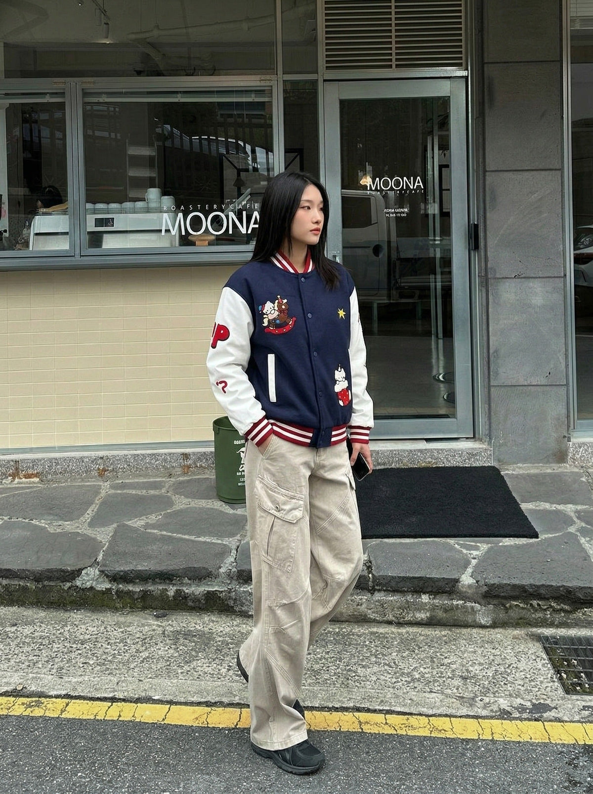 DAXUEN Relaxed fit varsity jacket with embroidered graphics — model photo