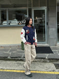 DAXUEN Relaxed fit varsity jacket with embroidered graphics — model photo