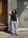 DAXUEN black vertical cable knit vest — model photo