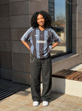 DAXUEN Short-sleeved vertical stripe polo shirt — model photo