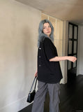 DAXUEN black oversized vertical text graphic t-shirt — model photo