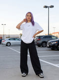 DAXUEN black oversized vertical text graphic t-shirt — model photo
