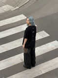 DAXUEN black oversized vertical text graphic t-shirt — model photo