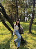 DAXUEN Light blue wide-leg denim jeans with embroidered patch — model photo