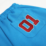 DAXUEN vibrant blue balloon-silhouette sweatpants with embroidered crest