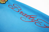 DAXUEN vibrant blue balloon-silhouette sweatpants with embroidered crest