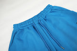 DAXUEN vibrant blue balloon-silhouette sweatpants with embroidered crest