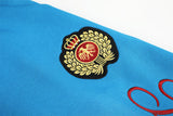 DAXUEN vibrant blue balloon-silhouette sweatpants with embroidered crest