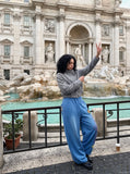 DAXUEN vibrant blue balloon-silhouette sweatpants with embroidered crest — model photo