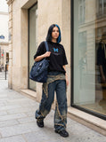 DAXUEN black oversized blue butterfly graphic tee — model photo