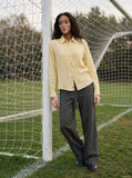 DAXUEN Pale yellow long-sleeved button-up shirt with colorful buttons — model photo