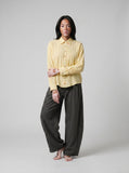 DAXUEN Pale yellow long-sleeved button-up shirt with colorful buttons — model photo