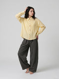 DAXUEN Pale yellow long-sleeved button-up shirt with colorful buttons — model photo