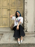 DAXUEN Oversized short-sleeved T-shirt with vibrant graphic print — model photo