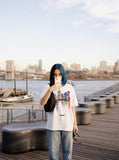 DAXUEN Oversized short-sleeved T-shirt with vibrant graphic print — model photo