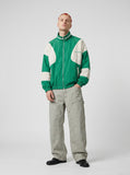 DAXUEN vibrant green colour-block track jacket — model photo