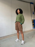 DAXUEN vibrant green relaxed-fit knee-length shorts — model photo