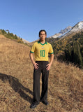 DAXUEN yellow short-sleeve mesh polo with emblem and number 10 — model photo