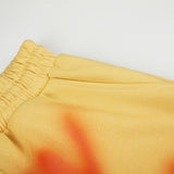 DAXUEN vibrant yellow oversized star graphic sweatpants
