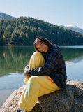 DAXUEN vibrant yellow oversized star graphic sweatpants — model photo