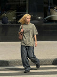 DAXUEN Vintage acid-wash graphic t-shirt — model photo
