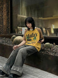 DAXUEN Vintage graphic t-shirt with beach scene print — model photo