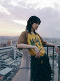 DAXUEN Vintage graphic t-shirt with beach scene print — model photo