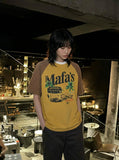 DAXUEN Vintage graphic t-shirt with beach scene print — model photo