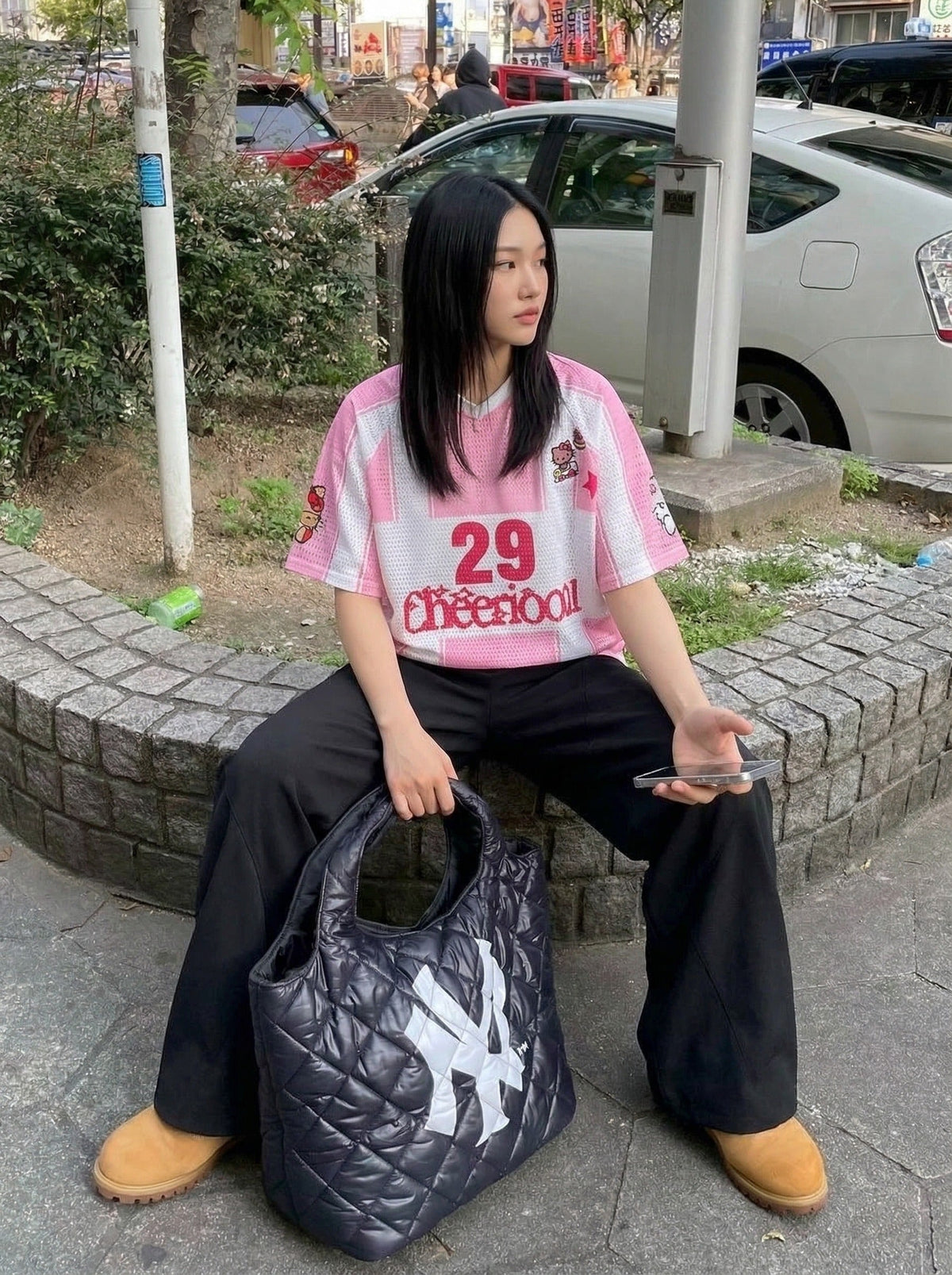 DAXUEN Relaxed-fit jersey-style T-shirt with cartoon graphics — model photo