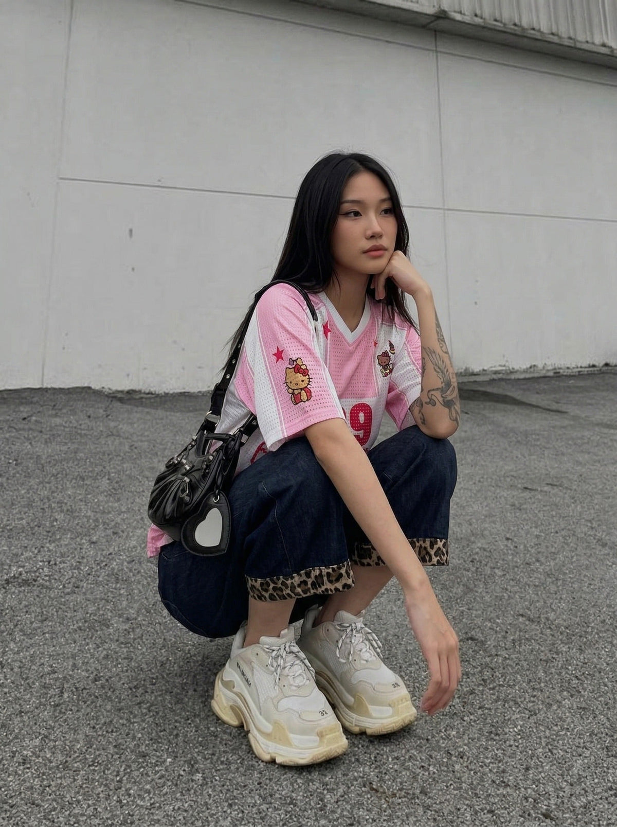 DAXUEN Relaxed-fit jersey-style T-shirt with cartoon graphics — model photo
