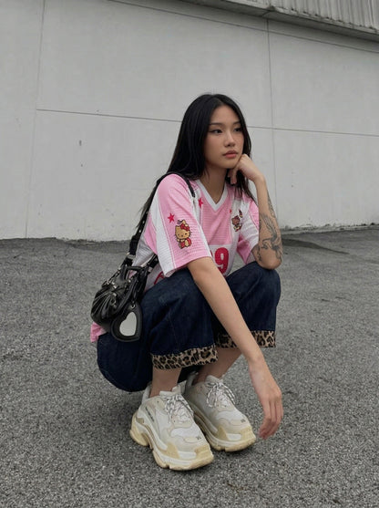 DAXUEN Relaxed-fit jersey-style T-shirt with cartoon graphics — model photo