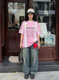DAXUEN Relaxed-fit jersey-style T-shirt with cartoon graphics — model photo