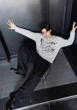 DAXUEN Long sleeve top with vintage compass graphic — model photo