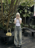 DAXUEN Wide-leg distressed denim pants — model photo