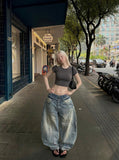 DAXUEN Wide-leg distressed denim pants — model photo