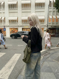 DAXUEN Wide-leg distressed denim pants — model photo