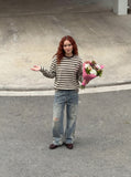 DAXUEN Distressed wide-leg jeans in washed light blue denim — model photo